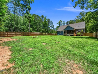 Resort-style living awaits in this beautifully crafted 2023 on River Golf and County Club at Lake Royale in North Carolina - for sale on GolfHomes.com, golf home, golf lot