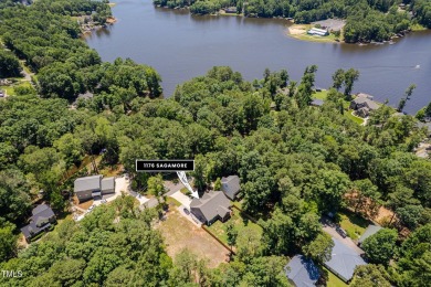 Resort-style living awaits in this beautifully crafted 2023 on River Golf and County Club at Lake Royale in North Carolina - for sale on GolfHomes.com, golf home, golf lot