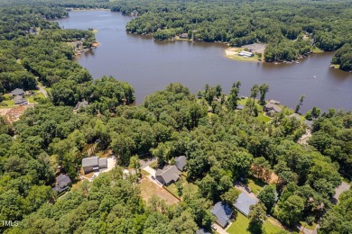 Resort-style living awaits in this beautifully crafted 2023 on River Golf and County Club at Lake Royale in North Carolina - for sale on GolfHomes.com, golf home, golf lot