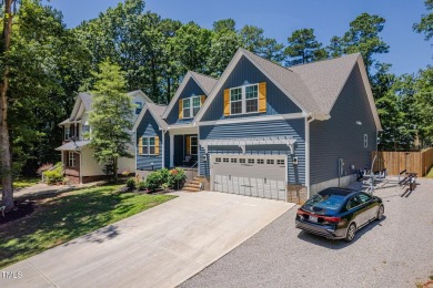 Resort-style living awaits in this beautifully crafted 2023 on River Golf and County Club at Lake Royale in North Carolina - for sale on GolfHomes.com, golf home, golf lot