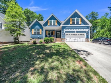 Resort-style living awaits in this beautifully crafted 2023 on River Golf and County Club at Lake Royale in North Carolina - for sale on GolfHomes.com, golf home, golf lot
