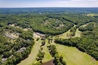 Resort-style living awaits in this beautifully crafted 2023 on River Golf and County Club at Lake Royale in North Carolina - for sale on GolfHomes.com, golf home, golf lot