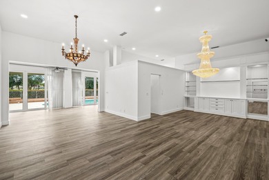 Elegantly and completely remodeled estate home with expansive on PGA National Golf Club in Florida - for sale on GolfHomes.com, golf home, golf lot