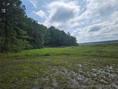 Hardwood trees and a gorgeous view! Build your dream home here on Woodlake Country Club in North Carolina - for sale on GolfHomes.com, golf home, golf lot