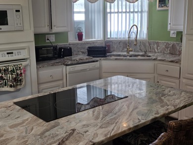 Lovely home on the golf course. This 2 bedroom with a den, 2 on Savanna Golf Club in Florida - for sale on GolfHomes.com, golf home, golf lot