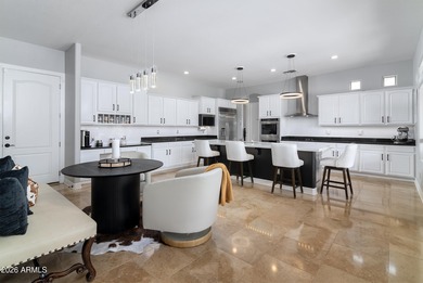 This exceptional home showcases a stunning open-concept design on Superstition Mountain Club - Lost Gold in Arizona - for sale on GolfHomes.com, golf home, golf lot