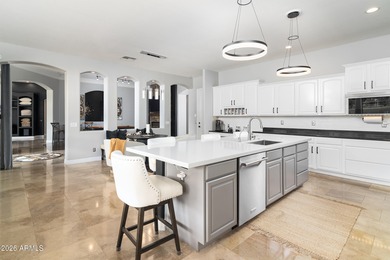 This exceptional home showcases a stunning open-concept design on Superstition Mountain Club - Lost Gold in Arizona - for sale on GolfHomes.com, golf home, golf lot