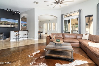 This exceptional home showcases a stunning open-concept design on Superstition Mountain Club - Lost Gold in Arizona - for sale on GolfHomes.com, golf home, golf lot