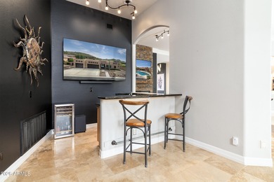 This exceptional home showcases a stunning open-concept design on Superstition Mountain Club - Lost Gold in Arizona - for sale on GolfHomes.com, golf home, golf lot