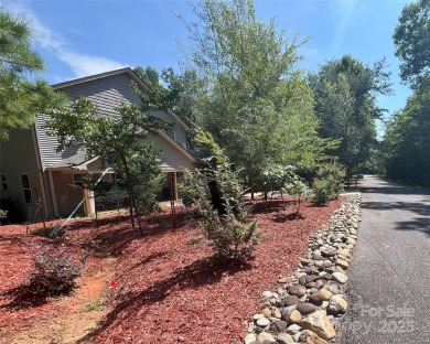 Offered turnkey and fully furnished, this energy efficient newer on Rumbling Bald Resort on Lake Lure in North Carolina - for sale on GolfHomes.com, golf home, golf lot