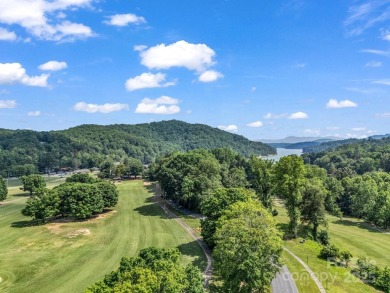 Offered turnkey and fully furnished, this energy efficient newer on Rumbling Bald Resort on Lake Lure in North Carolina - for sale on GolfHomes.com, golf home, golf lot