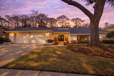 West-facing golf course views and sunset exposure define this on Countryside Country Club in Florida - for sale on GolfHomes.com, golf home, golf lot