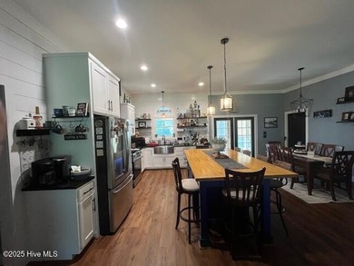 Welcome to beautiful home on large lot in gated community of on River Golf and Country Club at Lake Royale in North Carolina - for sale on GolfHomes.com, golf home, golf lot