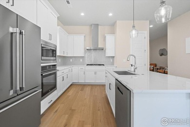 YOUR OWN PRIVATE FENCED BACKYARD + MAINTENANCE FREE? This is it! on Pelican Lakes Golf and Country Club in Colorado - for sale on GolfHomes.com, golf home, golf lot