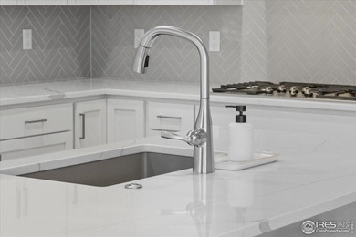 YOUR OWN PRIVATE FENCED BACKYARD + MAINTENANCE FREE? This is it! on Pelican Lakes Golf and Country Club in Colorado - for sale on GolfHomes.com, golf home, golf lot