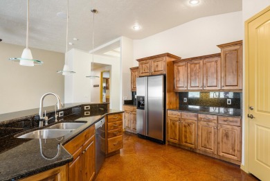 Well-kept home right on the golf course with red mountain views! on Green Spring Country Club in Utah - for sale on GolfHomes.com, golf home, golf lot