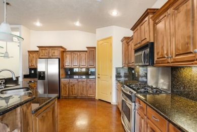 Well-kept home right on the golf course with red mountain views! on Green Spring Country Club in Utah - for sale on GolfHomes.com, golf home, golf lot