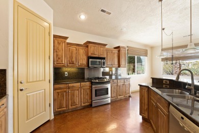 Well-kept home right on the golf course with red mountain views! on Green Spring Country Club in Utah - for sale on GolfHomes.com, golf home, golf lot