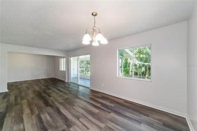 Move right in to this spacious unit with new plank flooring on Country Club At Silver Springs Shores in Florida - for sale on GolfHomes.com, golf home, golf lot