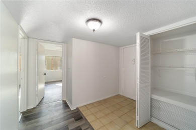 Move right in to this spacious unit with new plank flooring on Country Club At Silver Springs Shores in Florida - for sale on GolfHomes.com, golf home, golf lot