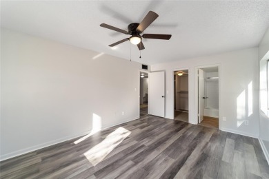 Move right in to this spacious unit with new plank flooring on Country Club At Silver Springs Shores in Florida - for sale on GolfHomes.com, golf home, golf lot