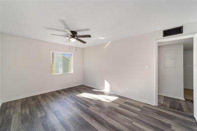 Move right in to this spacious unit with new plank flooring on Country Club At Silver Springs Shores in Florida - for sale on GolfHomes.com, golf home, golf lot