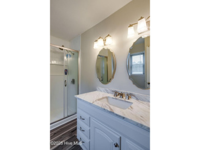 Welcome to 1513 Caracara Drive - Comfort, Style & Security in on Harbour Point Golf Club in North Carolina - for sale on GolfHomes.com, golf home, golf lot
