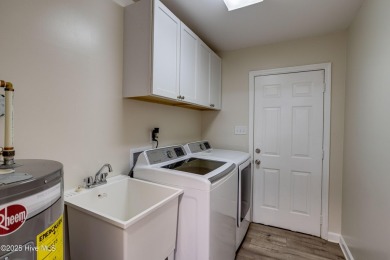 Welcome to 1513 Caracara Drive - Comfort, Style & Security in on Harbour Point Golf Club in North Carolina - for sale on GolfHomes.com, golf home, golf lot