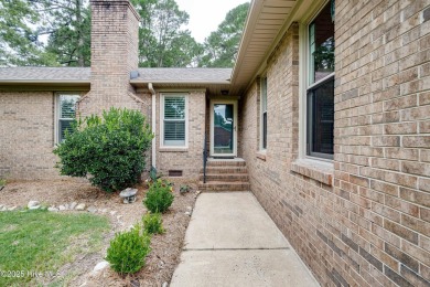 Welcome to 1513 Caracara Drive - Comfort, Style & Security in on Harbour Point Golf Club in North Carolina - for sale on GolfHomes.com, golf home, golf lot