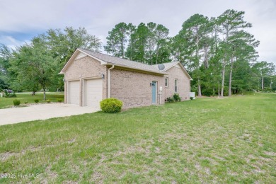 Welcome to 1513 Caracara Drive - Comfort, Style & Security in on Harbour Point Golf Club in North Carolina - for sale on GolfHomes.com, golf home, golf lot