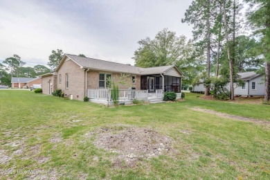 Welcome to 1513 Caracara Drive - Comfort, Style & Security in on Harbour Point Golf Club in North Carolina - for sale on GolfHomes.com, golf home, golf lot