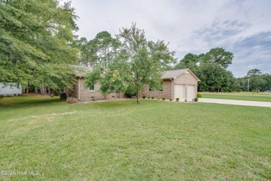 Welcome to 1513 Caracara Drive - Comfort, Style & Security in on Harbour Point Golf Club in North Carolina - for sale on GolfHomes.com, golf home, golf lot