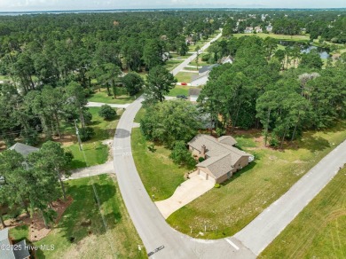 Welcome to 1513 Caracara Drive - Comfort, Style & Security in on Harbour Point Golf Club in North Carolina - for sale on GolfHomes.com, golf home, golf lot