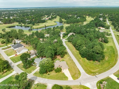 Welcome to 1513 Caracara Drive - Comfort, Style & Security in on Harbour Point Golf Club in North Carolina - for sale on GolfHomes.com, golf home, golf lot