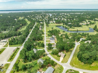 Welcome to 1513 Caracara Drive - Comfort, Style & Security in on Harbour Point Golf Club in North Carolina - for sale on GolfHomes.com, golf home, golf lot