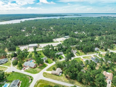 Welcome to 1513 Caracara Drive - Comfort, Style & Security in on Harbour Point Golf Club in North Carolina - for sale on GolfHomes.com, golf home, golf lot