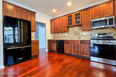 Extended Aragon model with four-season sunroom and front porch on Renaissance Country Club in New Jersey - for sale on GolfHomes.com, golf home, golf lot