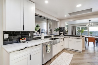 An amazing contemporary split-level home near Arroyo Del Oso on Arroyo Del Oso Golf Course in New Mexico - for sale on GolfHomes.com, golf home, golf lot