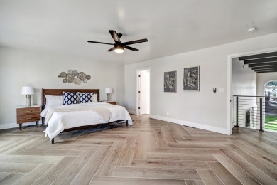 An amazing contemporary split-level home near Arroyo Del Oso on Arroyo Del Oso Golf Course in New Mexico - for sale on GolfHomes.com, golf home, golf lot