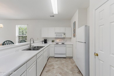 Don't Miss This First Floor - Golf  Pond View Condo in Sandpiper on Sandpiper Bay Golf and Country Club in North Carolina - for sale on GolfHomes.com, golf home, golf lot