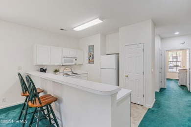Don't Miss This First Floor - Golf  Pond View Condo in Sandpiper on Sandpiper Bay Golf and Country Club in North Carolina - for sale on GolfHomes.com, golf home, golf lot