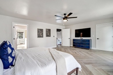 An amazing contemporary split-level home near Arroyo Del Oso on Arroyo Del Oso Golf Course in New Mexico - for sale on GolfHomes.com, golf home, golf lot