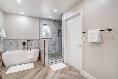 An amazing contemporary split-level home near Arroyo Del Oso on Arroyo Del Oso Golf Course in New Mexico - for sale on GolfHomes.com, golf home, golf lot