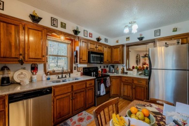Enjoy stunning golf-front views of the #5 Fairway from the front on Bella Vista - Metfield Golf Complex and Country Club in Arkansas - for sale on GolfHomes.com, golf home, golf lot