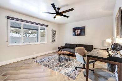 An amazing contemporary split-level home near Arroyo Del Oso on Arroyo Del Oso Golf Course in New Mexico - for sale on GolfHomes.com, golf home, golf lot