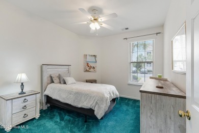 Don't Miss This First Floor - Golf  Pond View Condo in Sandpiper on Sandpiper Bay Golf and Country Club in North Carolina - for sale on GolfHomes.com, golf home, golf lot