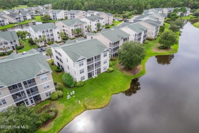 Don't Miss This First Floor - Golf  Pond View Condo in Sandpiper on Sandpiper Bay Golf and Country Club in North Carolina - for sale on GolfHomes.com, golf home, golf lot
