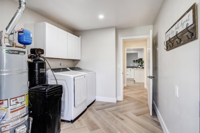 An amazing contemporary split-level home near Arroyo Del Oso on Arroyo Del Oso Golf Course in New Mexico - for sale on GolfHomes.com, golf home, golf lot