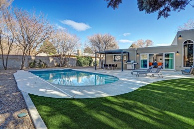 An amazing contemporary split-level home near Arroyo Del Oso on Arroyo Del Oso Golf Course in New Mexico - for sale on GolfHomes.com, golf home, golf lot