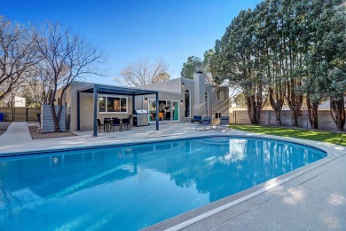 An amazing contemporary split-level home near Arroyo Del Oso on Arroyo Del Oso Golf Course in New Mexico - for sale on GolfHomes.com, golf home, golf lot